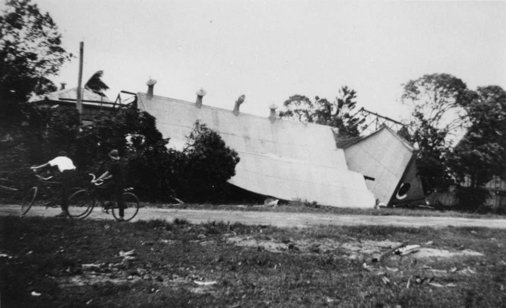 Damage to a Catholic Church in Cairns caused by a cyclone, 1927,  'John Oxley Library, State Library of Queensland Image: 161863'